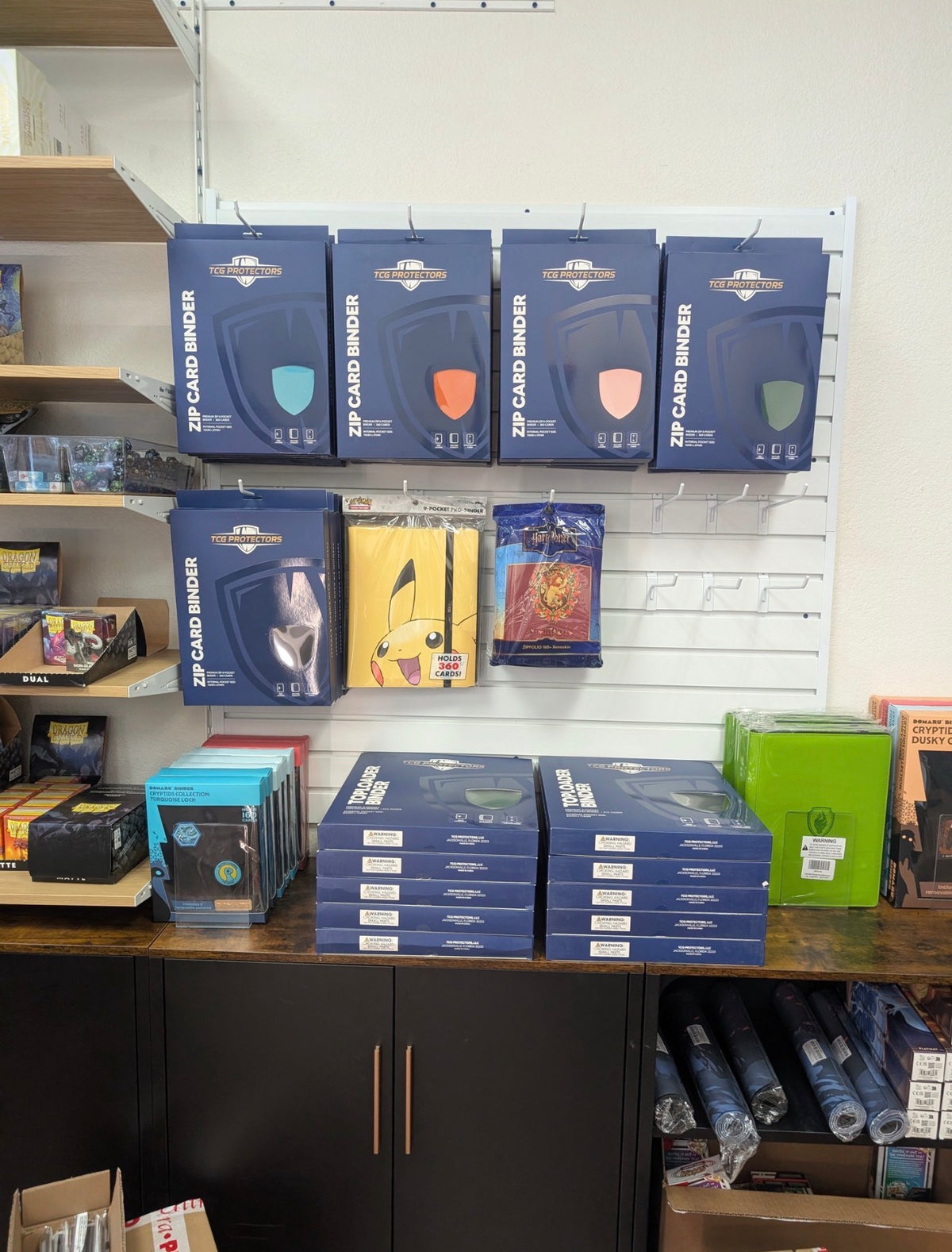 TCG Protectors binders on a retail shelf