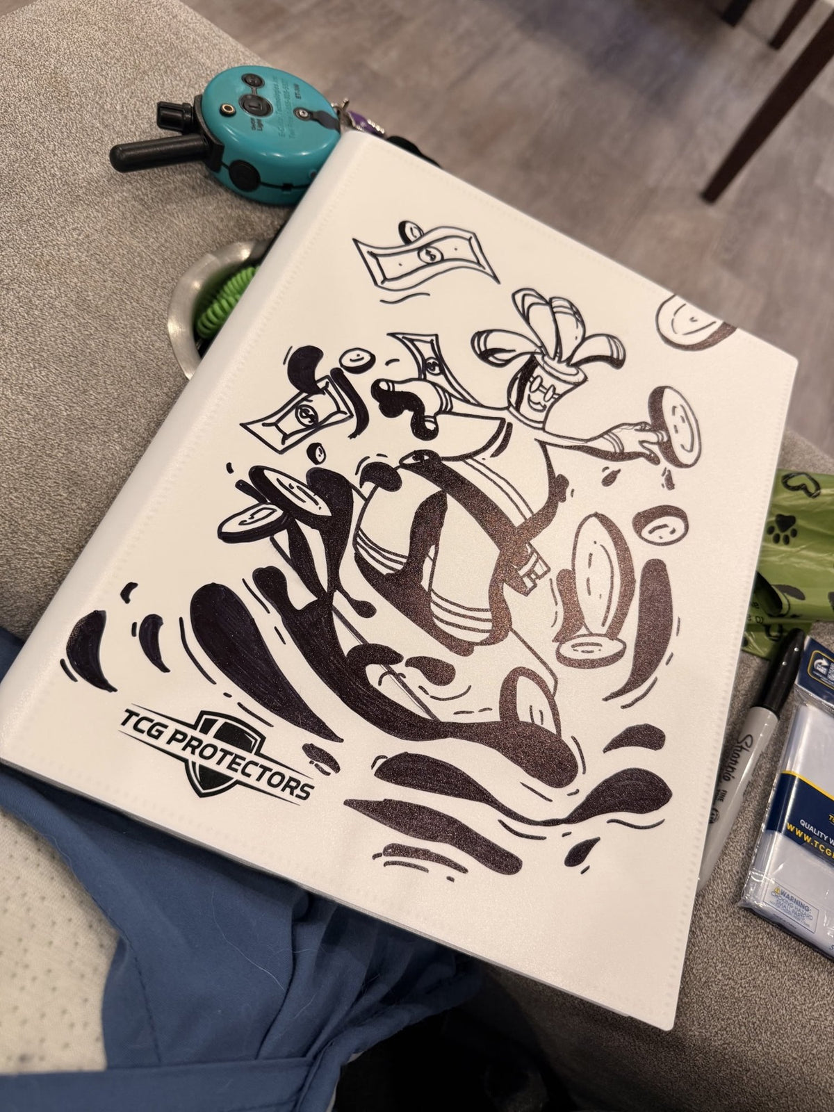 Line-art painted TCG Protectors binder in progress