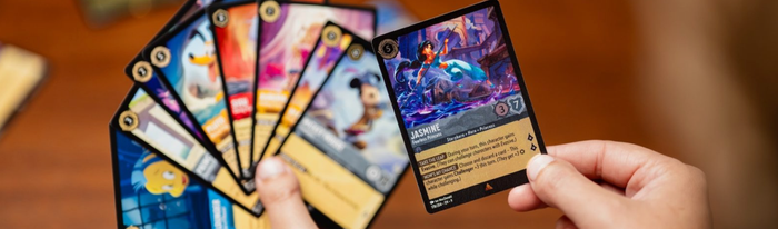 Building Your Lorcana Collection in 2026 – Hand holding a beautiful Jasmine Fearless Princess card from Disney Lorcana TCG.